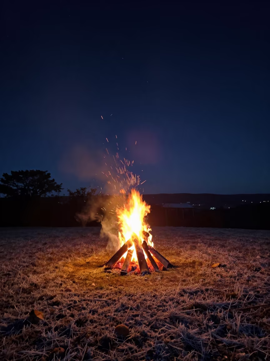 Bonfire Sparks Rising Into Starry Night Sky in from a frost-hushed ridgeline in Rio Grande do Sul