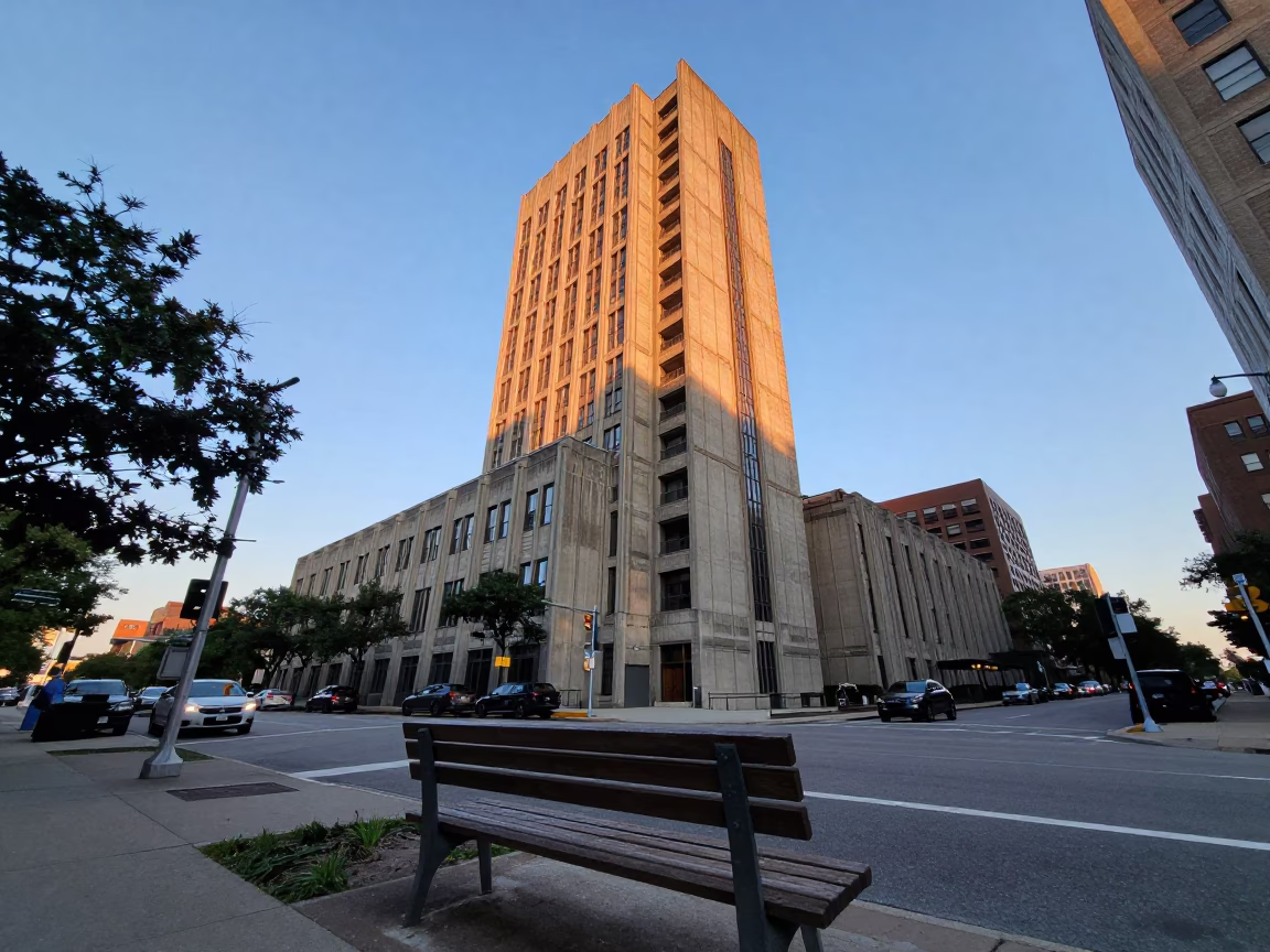 Boston Early Evening Street Scene with Brutalist Concrete Tower and Sunlight on Bench in in Boston, Massachusetts, United States