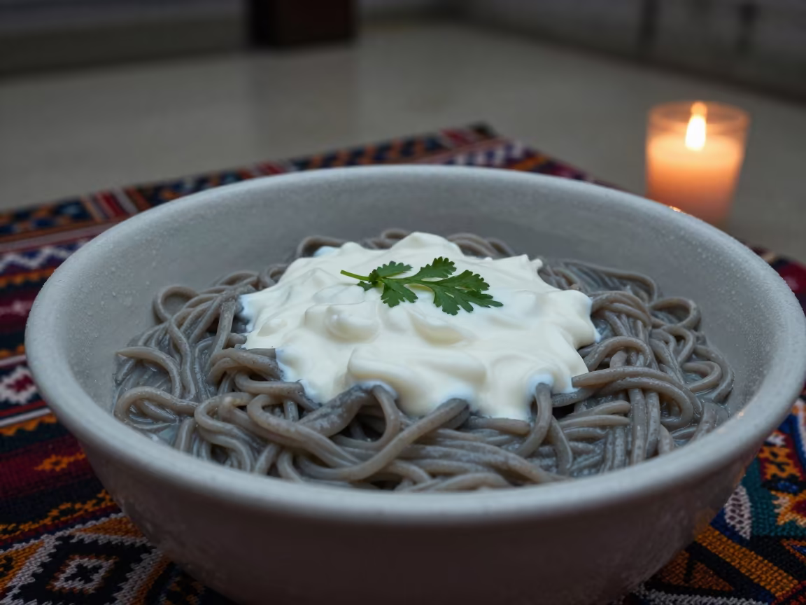 Bowl of Ash Reshteh Kashk on Picnic Blanket in on a picnic blanket in Surabaya
