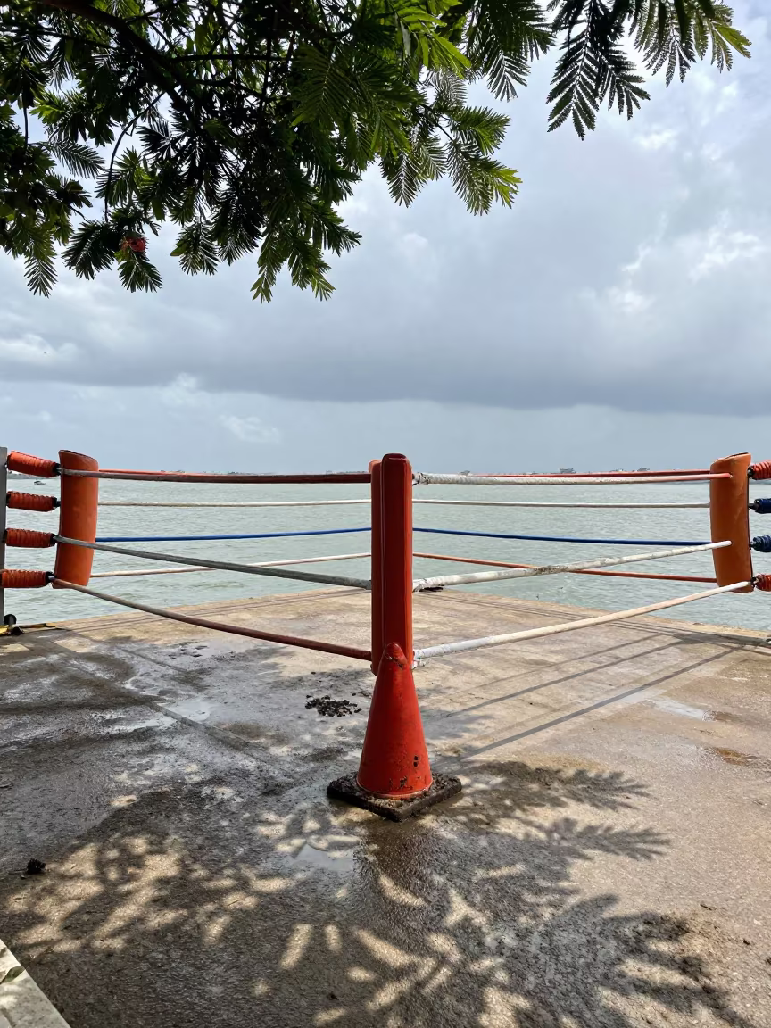 Boxing Corner Under Noon Lamps in at a harbor quay near Yaounde