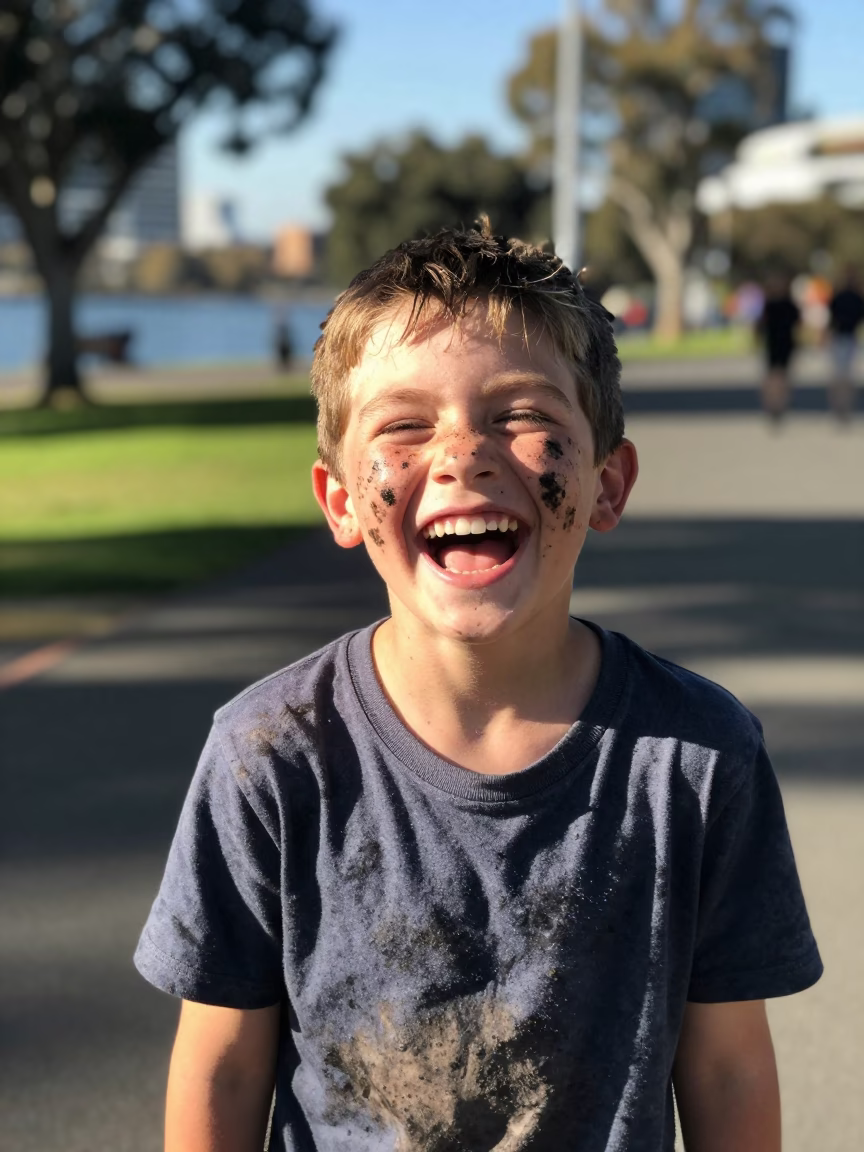 Boy Laughing at Bright Midmorning Light in Perth in in Perth, Western Australia, Australia