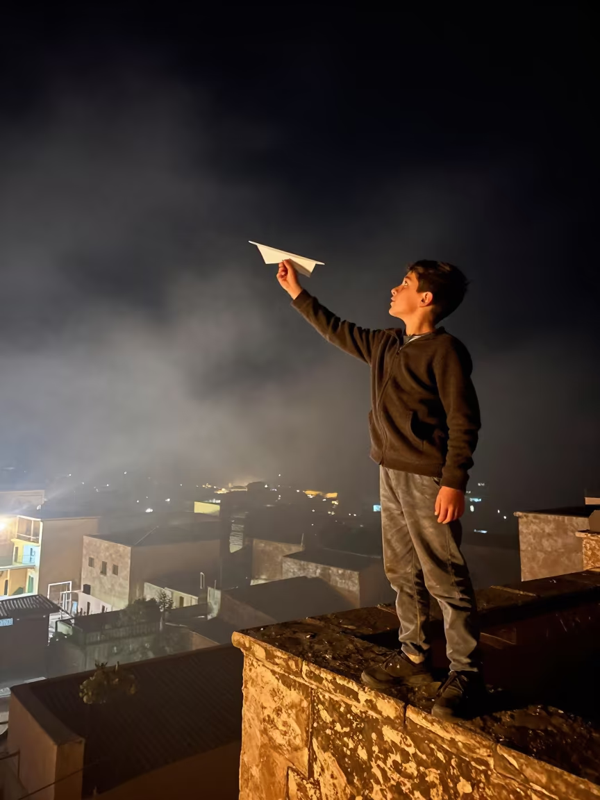 Boy Launches Paper Airplane from Khenifra Balcony in in Khenifra