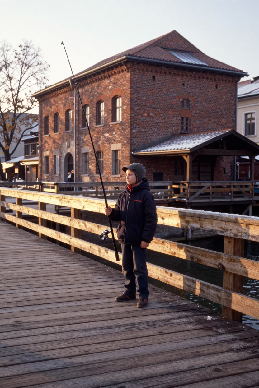 Boy with Tall Fishing Rod on Budapest Dock in near Ruin Bar District, Budapest