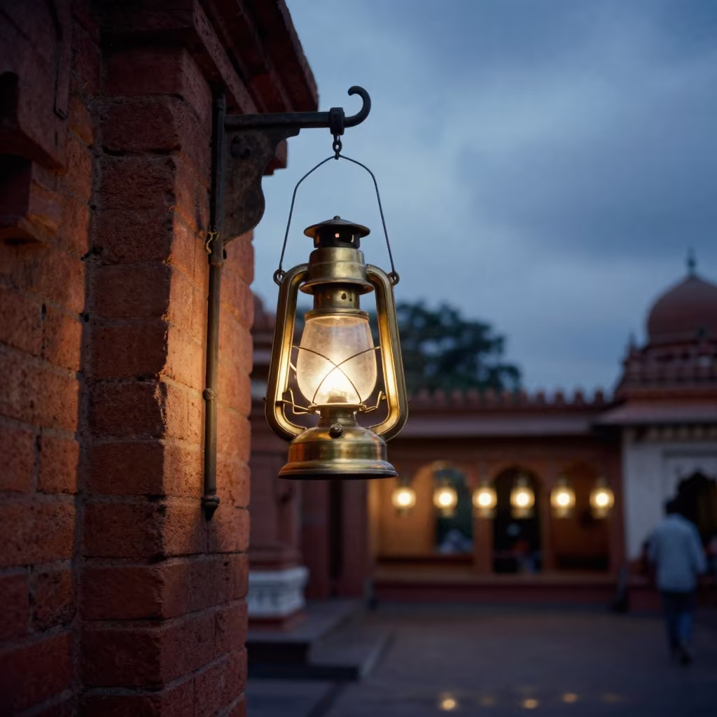 Brass Coach Lantern on Shrine Wall at Dusk in in a shrine lined with lanterns near Hyderabad