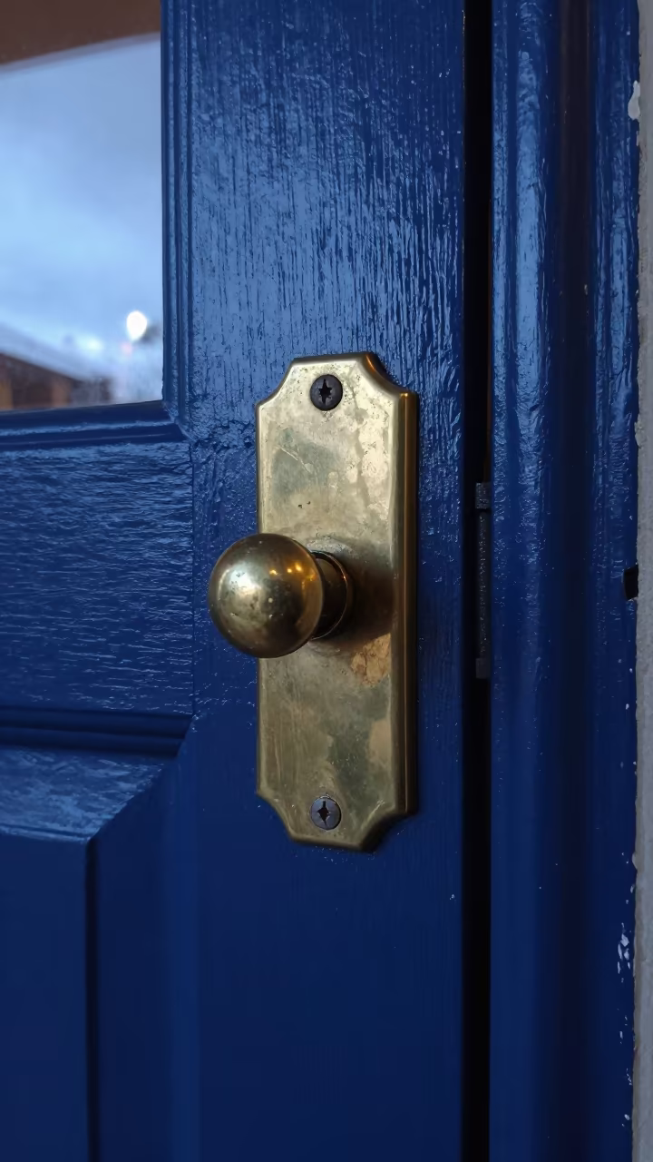 Brass Escutcheon on Winter Hotel Door in on a hotel dresser in Nelson