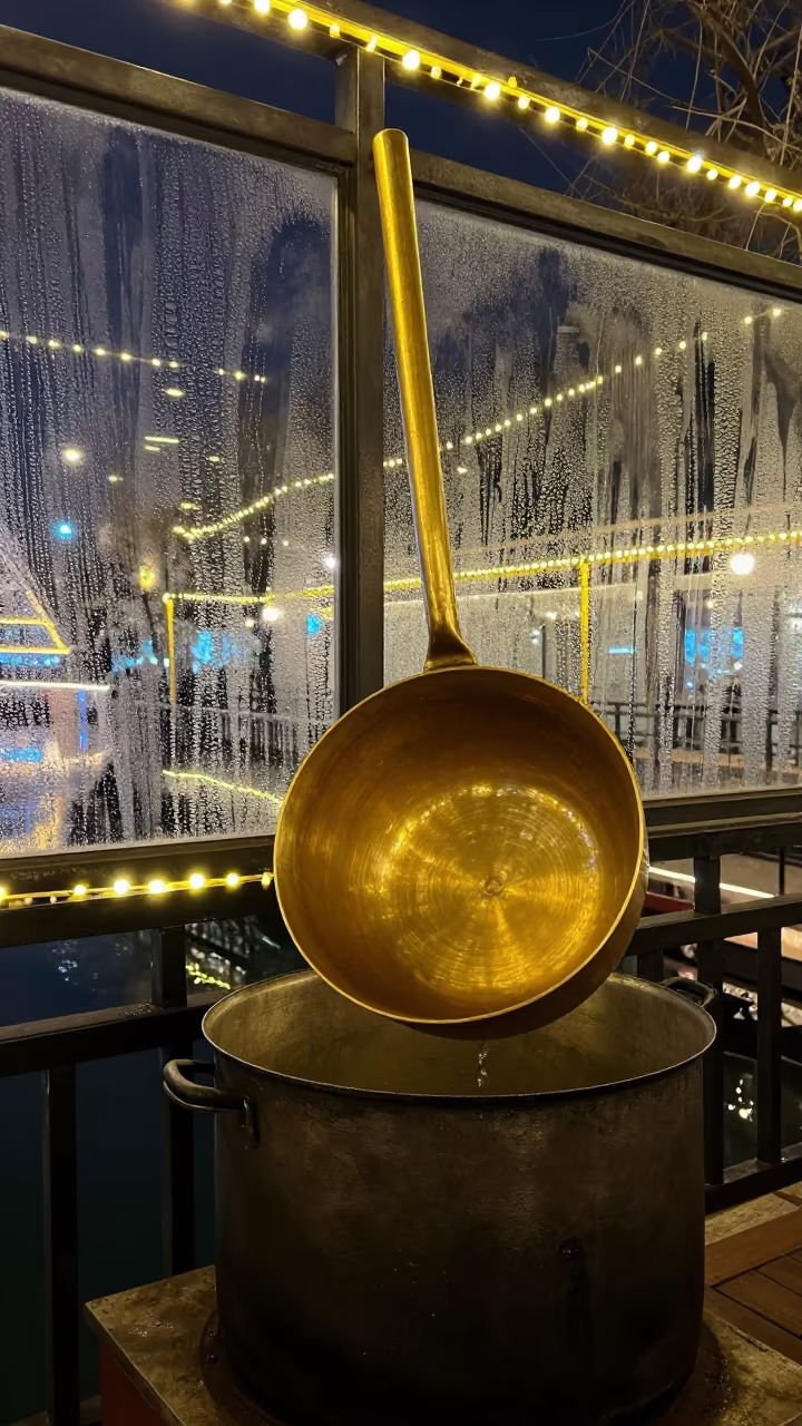 Brass Ladle Beside Stockpot on Jinan Pier in on a pier railing in Jinan