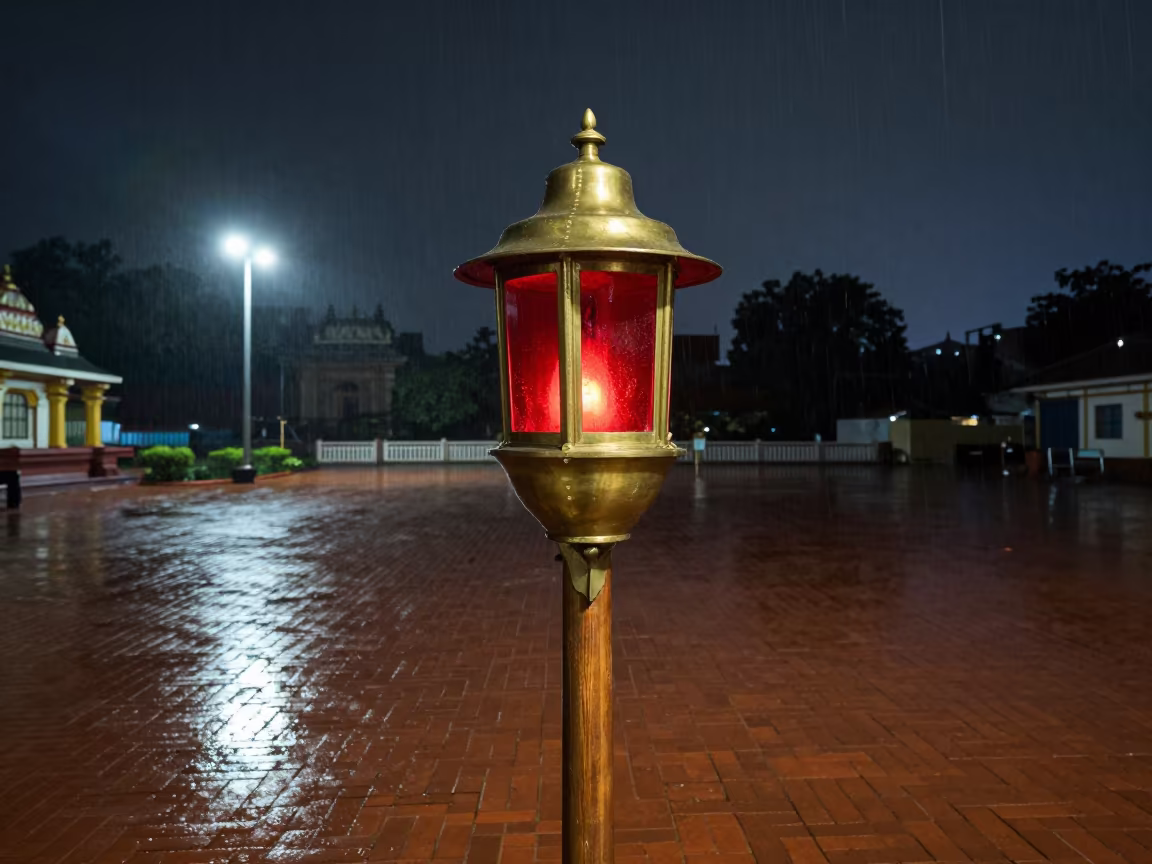Brass Lantern with Red Lens on Mumbai Dock in in a temple courtyard in Juhu, Mumbai