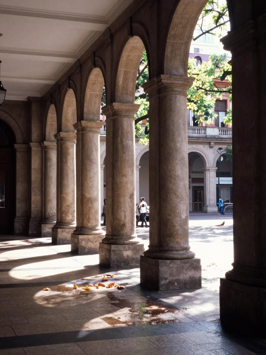 Bright Midmorning Street Scene in Buenos Aires with University Arcade and Wet Leaves in in Buenos Aires, Argentina