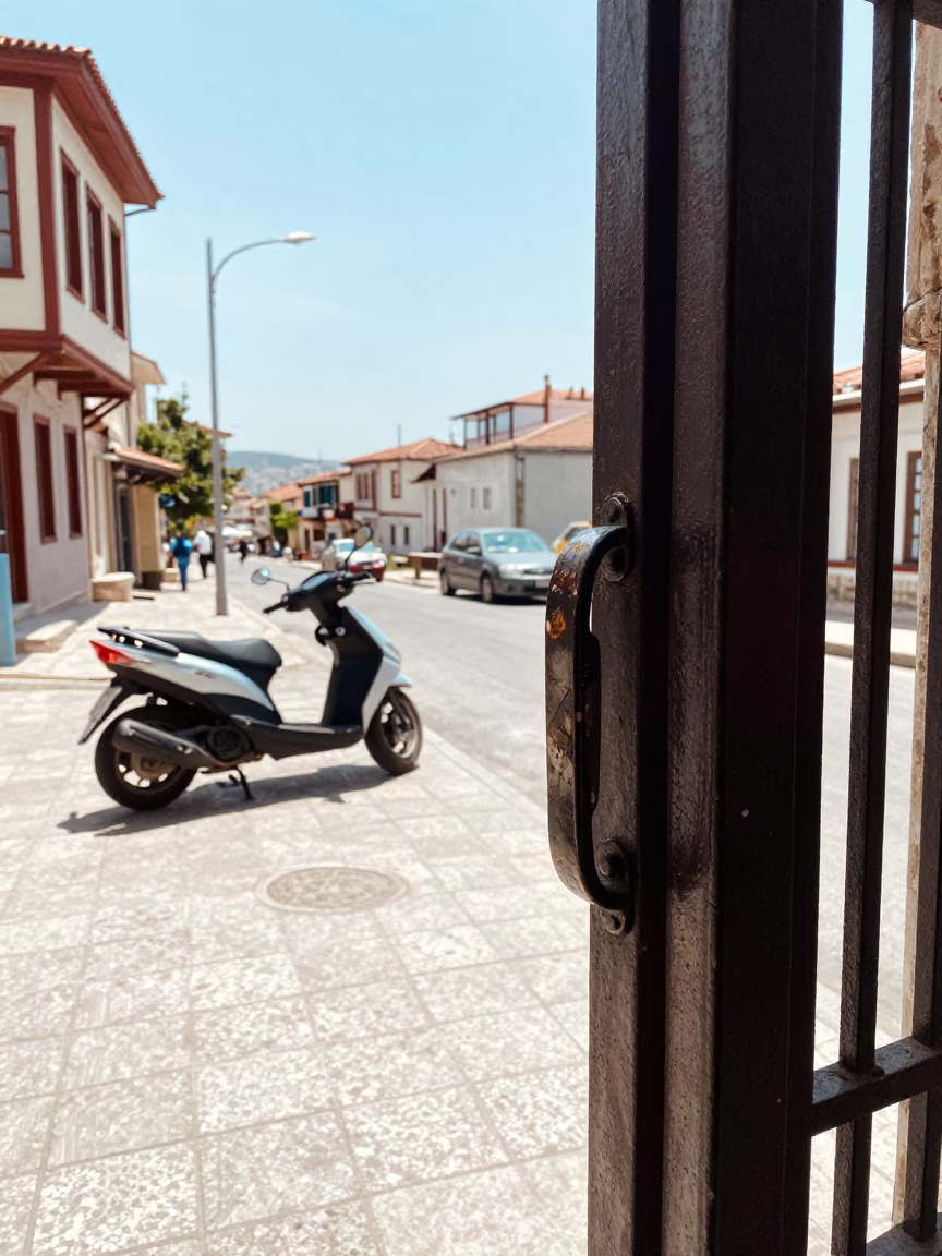 Bright Noon Street Scene in Izmir Turkey with Gate Handle and Scooter in in Izmir, Turkey