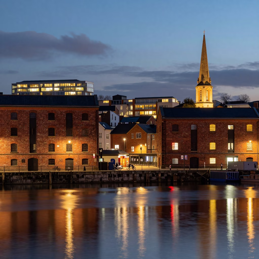 Bristol City Lights Glow Over Harbourside Evening with Local Street Scene in in Bristol, United Kingdom