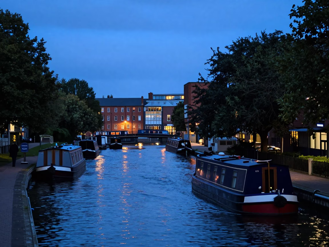 Bristol Docks Evening Scene with Barge on Tree Lined Canal Under Blue Light in in Bristol, United Kingdom