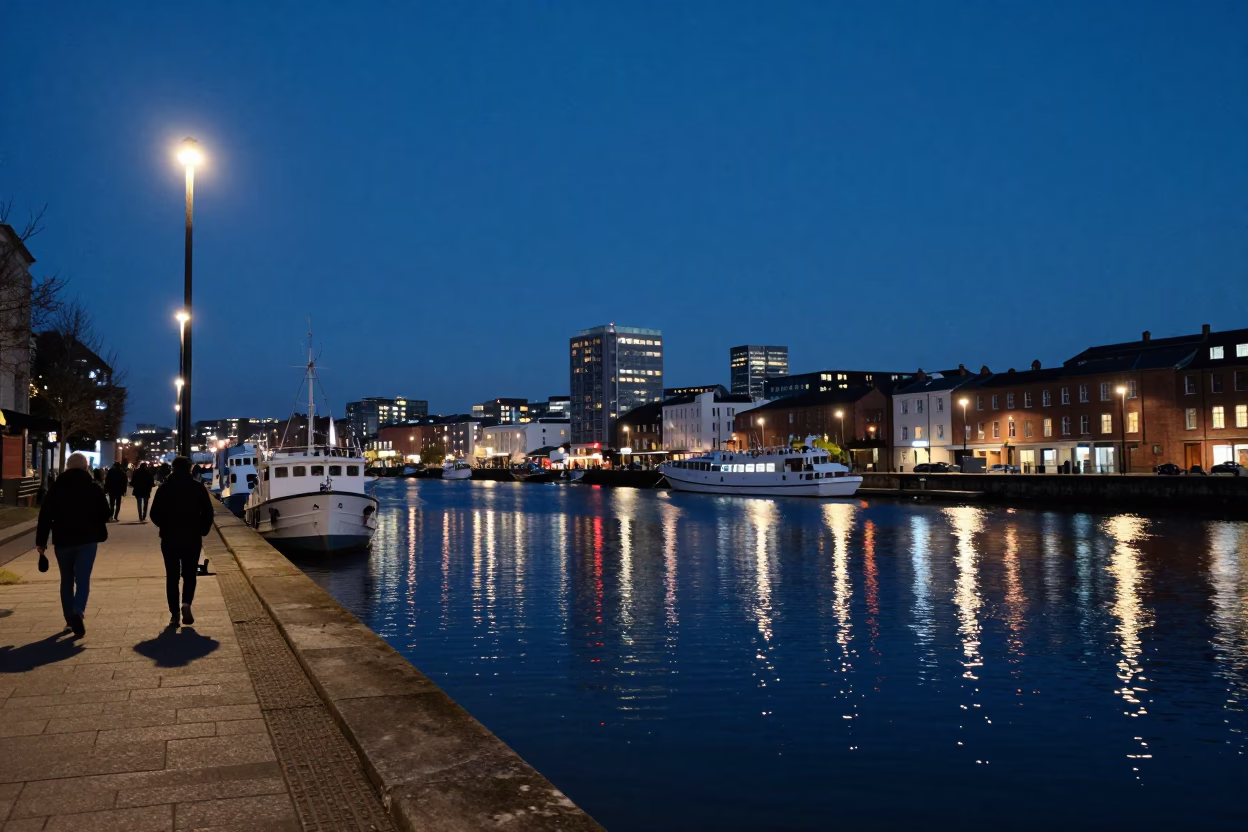 Bristol Harbor Blue Hour City Lights Glow Over Waterfront and Docked Boats in in Bristol, United Kingdom