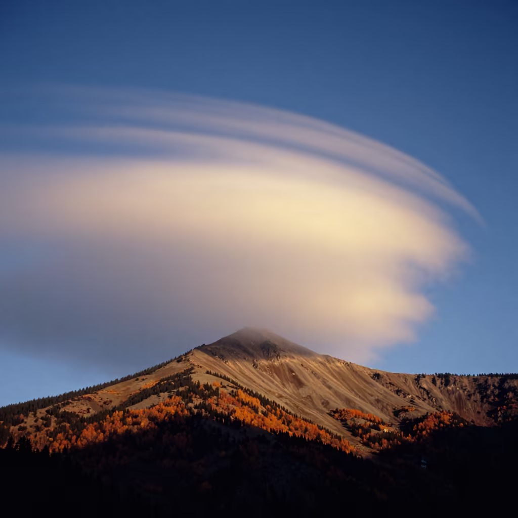 Brocken Spectre Silhouette on Misty Ridge in beneath fast-moving cloud bands in British Columbia