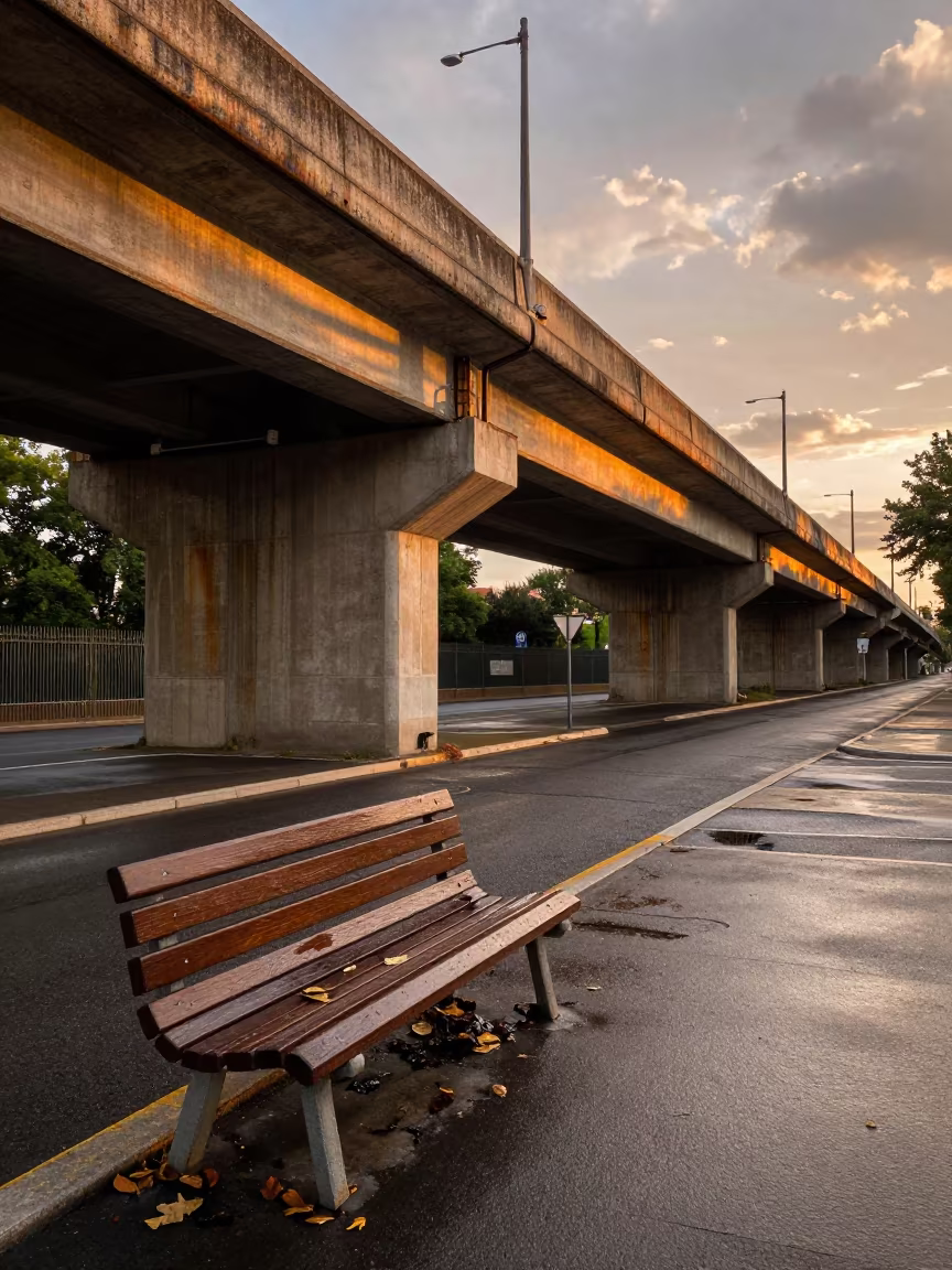 Broken Bench Under Montpellier Train Tracks in under an elevated train line in Montpellier