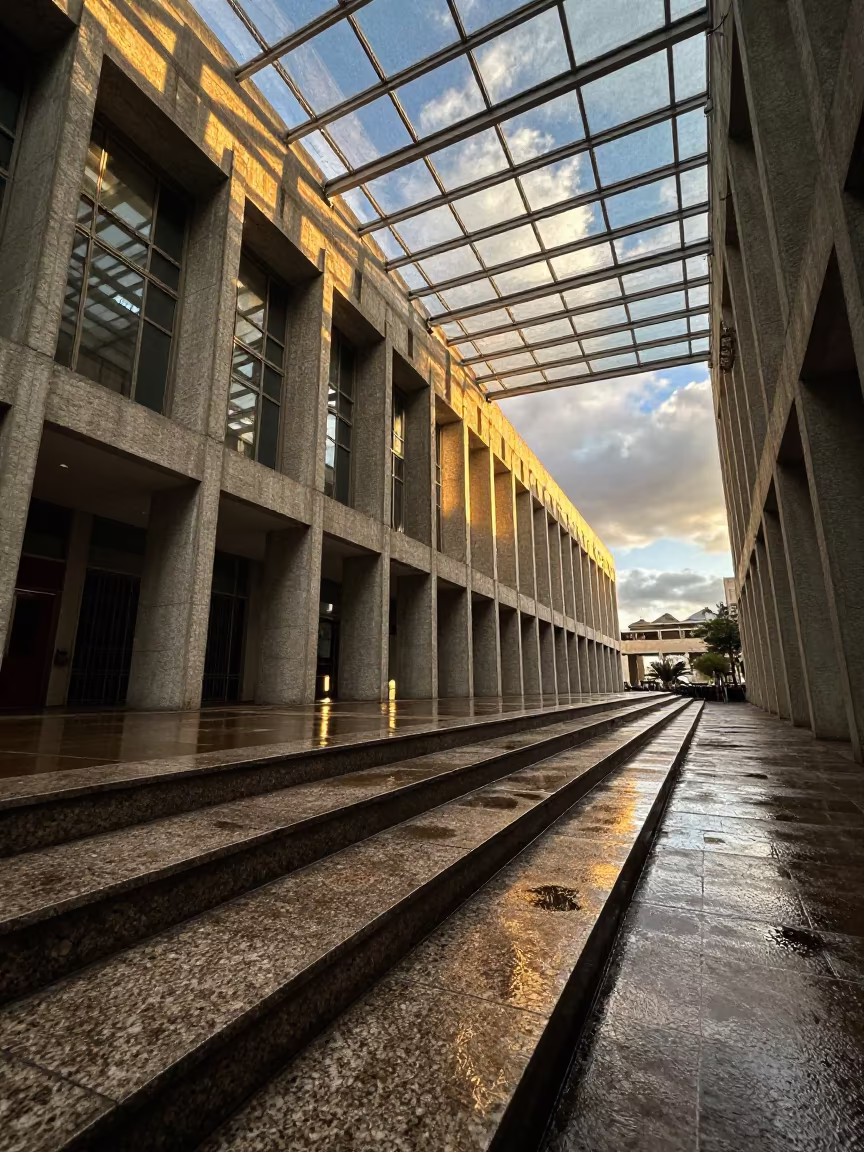 Brutalist Civic Center Golden Hour Granite Steps in inside a glass-roofed arcade in Sao Luis