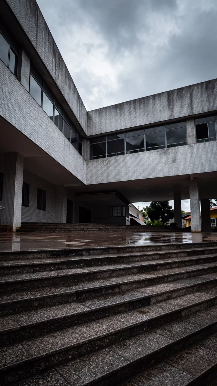 Brutalist Civic Center Wet Granite Steps Winter Sun in inside a tiled stair hall in Lubumbashi