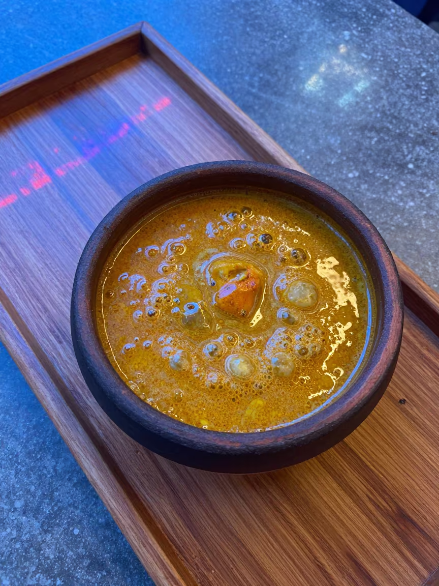 Bubbling Curry on Stone-Grain Tea Tray in on a tea house tray in Skala, Essaouira