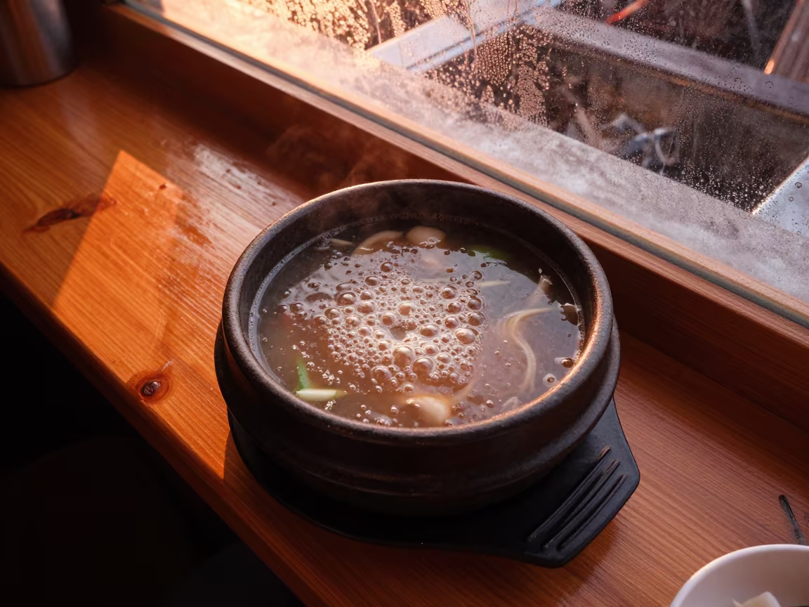 Bubbling Korean Stew Bowl on Noodle Counter in at a noodle counter in Tocuyito