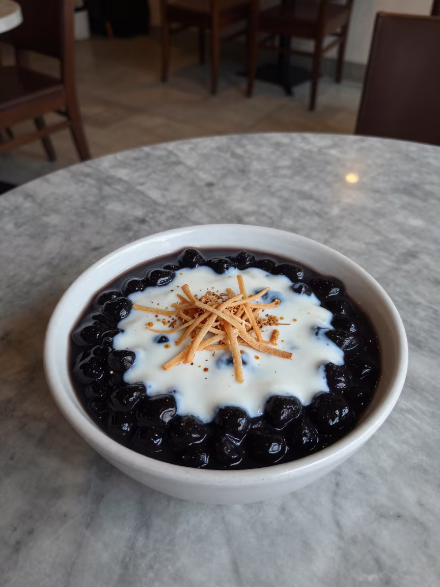 Bubur Ketan Hitam with Coconut on Marble Table in on a marble cafe table in Maceio