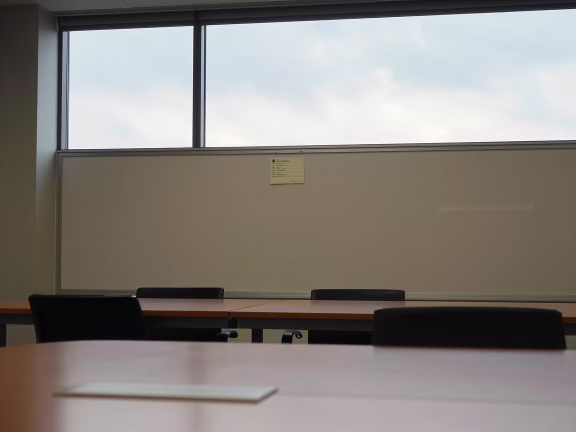 Bulletin Wall and Glass Near Arnhem Boardroom in at a boardroom table before a meeting near Arnhem