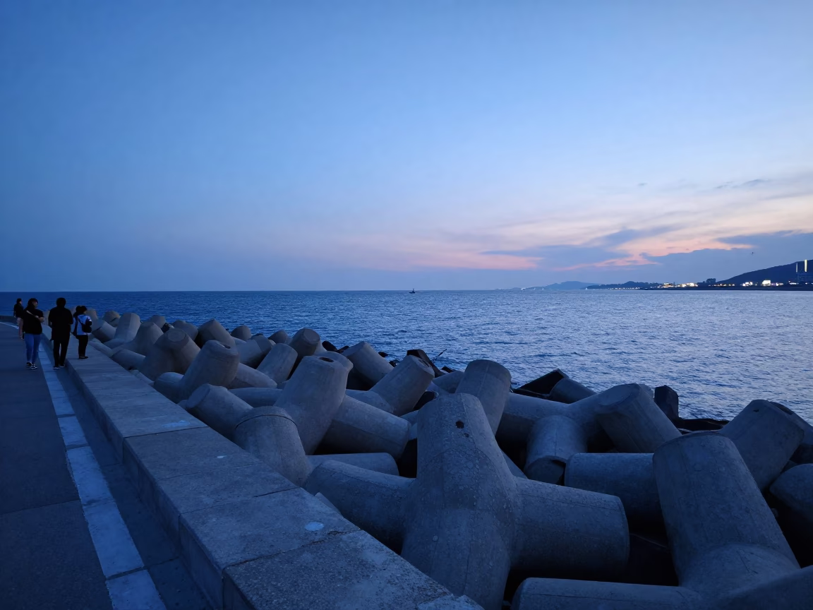 Busan South Korea Blue Hour Harbor Breakwater View with Fading Evening Light in in Busan, South Korea