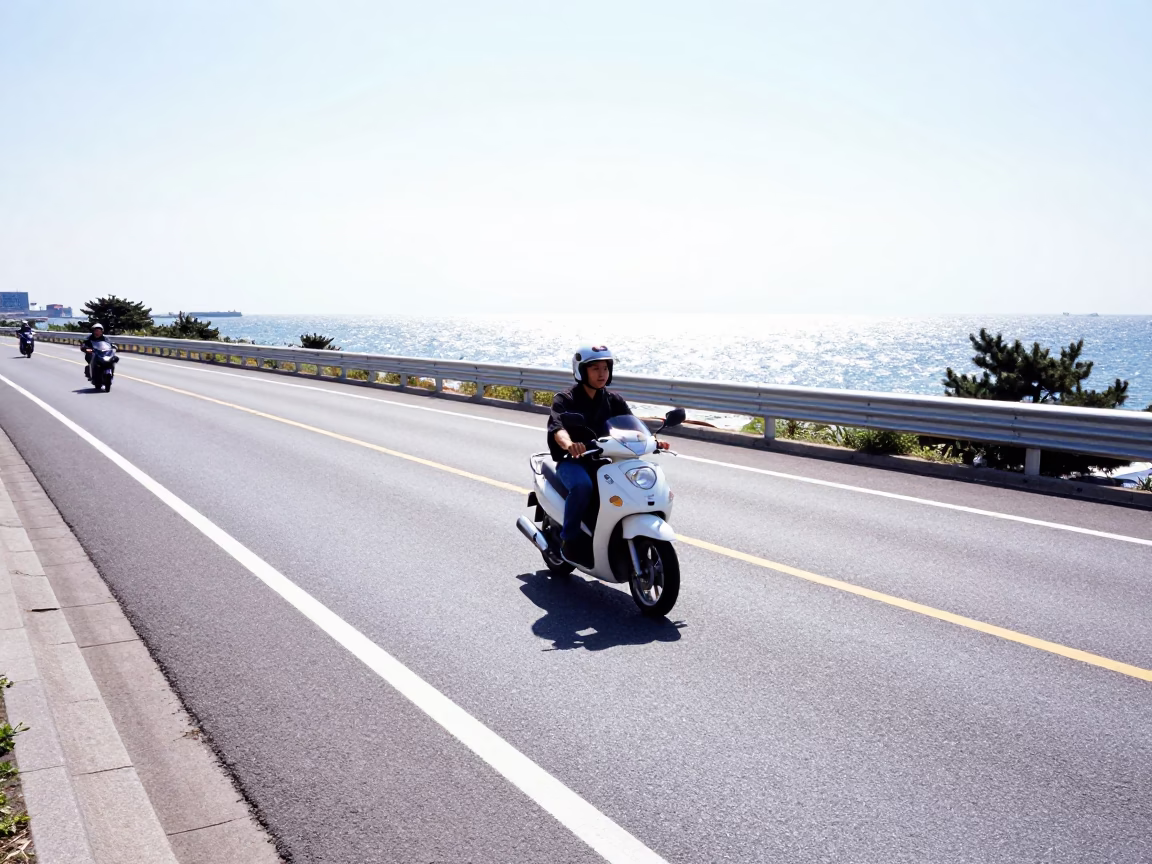 Busan South Korea Coastal Highway Motorcycle Traffic Under Flat Noon Sunlight in in Busan, South Korea