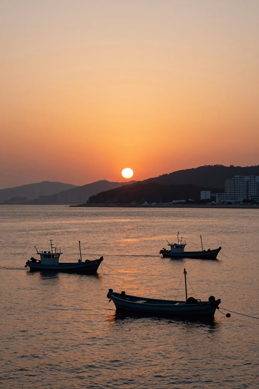 Busan Sunset Harbor View with Fishing Boats and Coastal Cityscape at Dusk in in Busan, South Korea