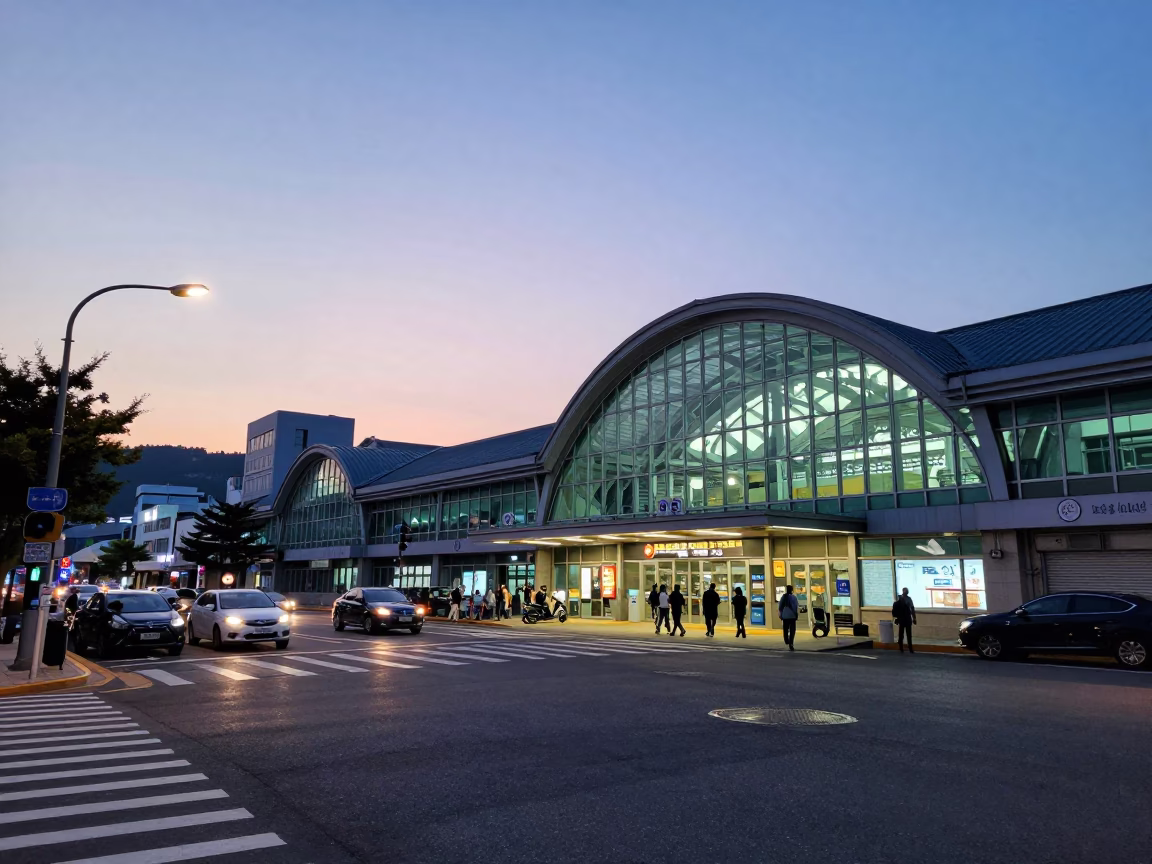 Busan twilight street scene with glass steel train station and local commuters in in Busan, South Korea
