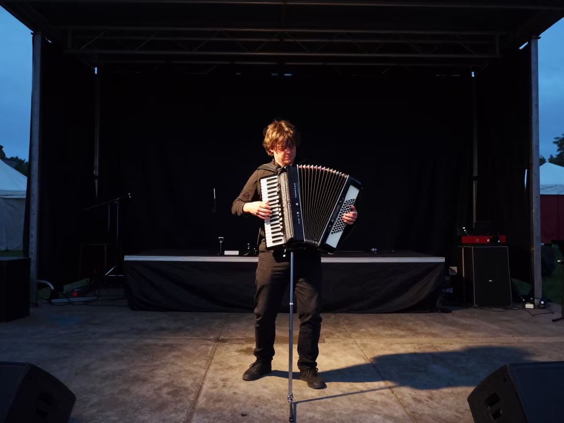Busker Accordion Predawn Stage Blantyre in on a festival main stage in Blantyre