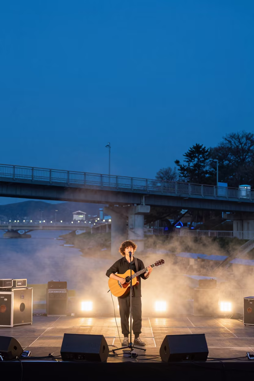 Busker Guitarist on Festival Stage in Busan Twilight in on a festival main stage in Busan