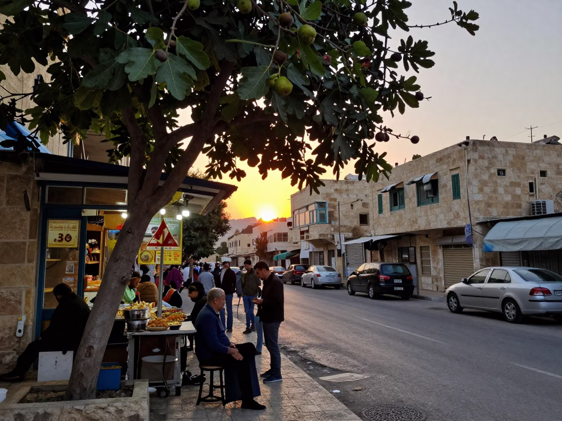 Busy Amman Street Corner at Dusk with Fig Tree and Local Market Activity in in Amman, Jordan