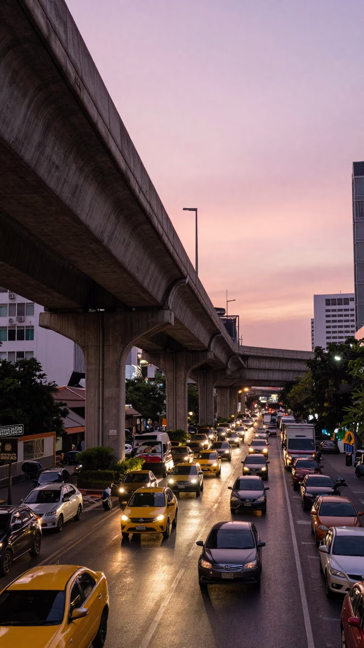 Busy Bangkok Street Scene with Highway Flyover and Evening Sky in in Bangkok, Thailand