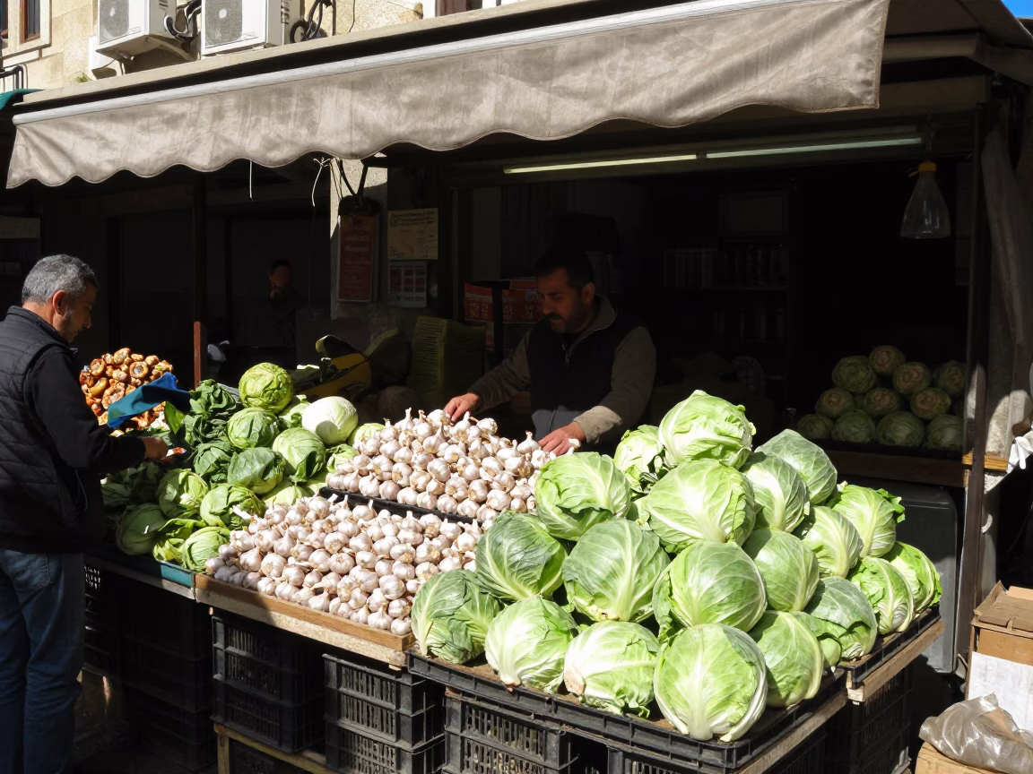Busy Beirut Market Stall with Garlic Bulbs and Cabbages Under Midday Sun in in Beirut, Lebanon