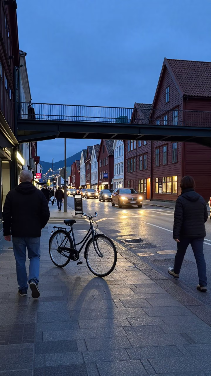 Busy Bergen Norway Blue Hour Street Scene with Vintage Bicycle and Pedestrian Overpass in in Bergen, Norway