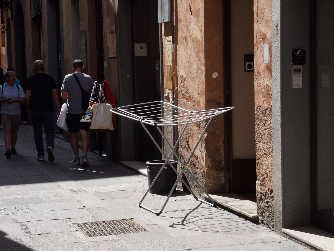 Busy Bologna Street Scene Under Flat Noon Light with Drying Rack and Nectarines in in Bologna, Italy