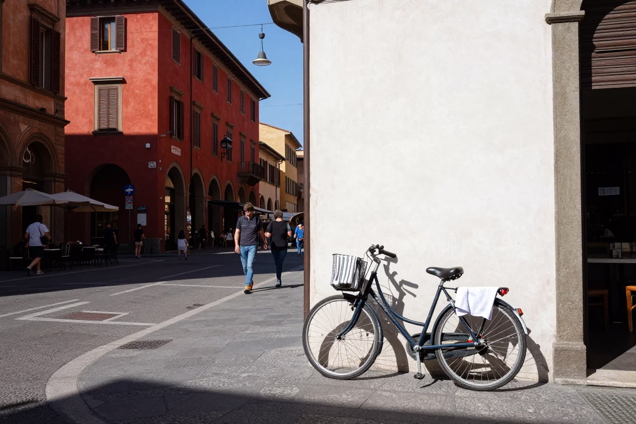 Busy Bologna Street Scene with Bicycle and Cafe Towels in in Bologna, Italy