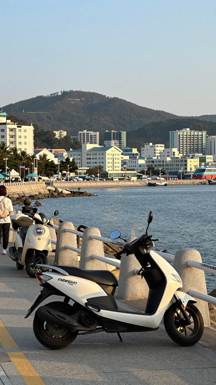 Busy Busan Harbor Promenade Early Afternoon with Parked Scooter and Local Street Life in in Busan, South Korea