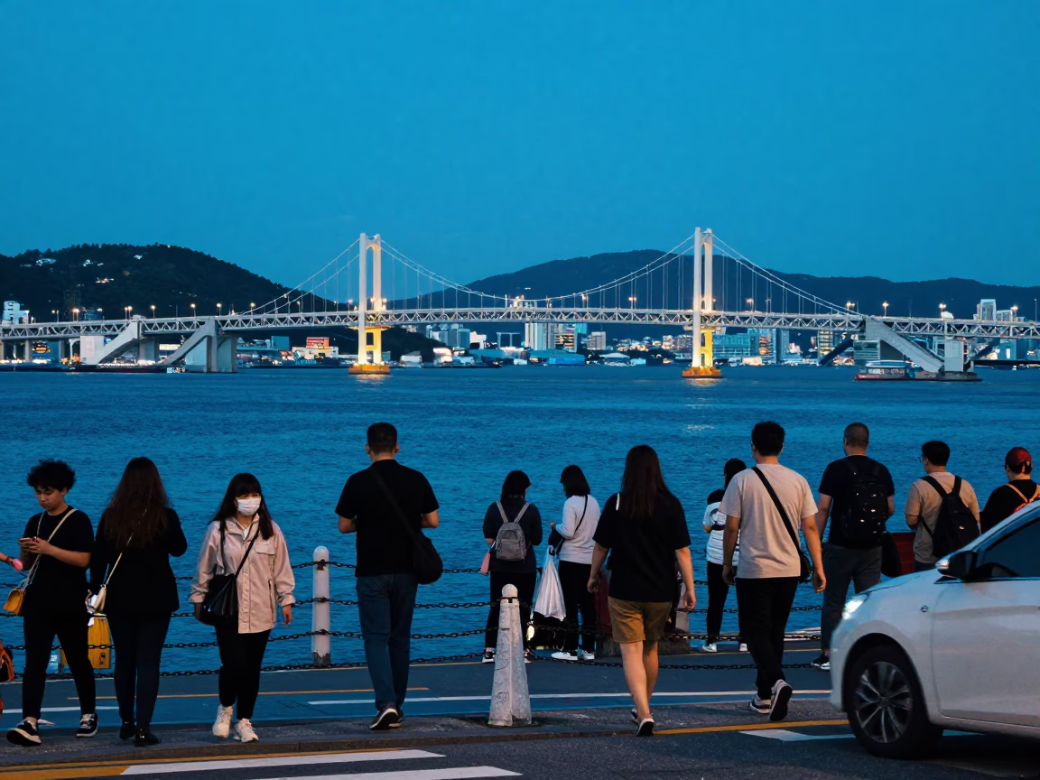 Busy Busan Street Corner Evening Blue Hour with Chain Ferry Crossing Hwangdo Bridge Background in in Busan, South Korea