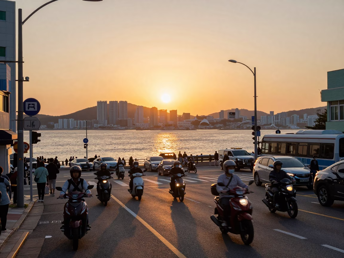 Busy Busan Street Intersection at Sunset with Motorcycles and Glass Tumbler in in Busan, South Korea