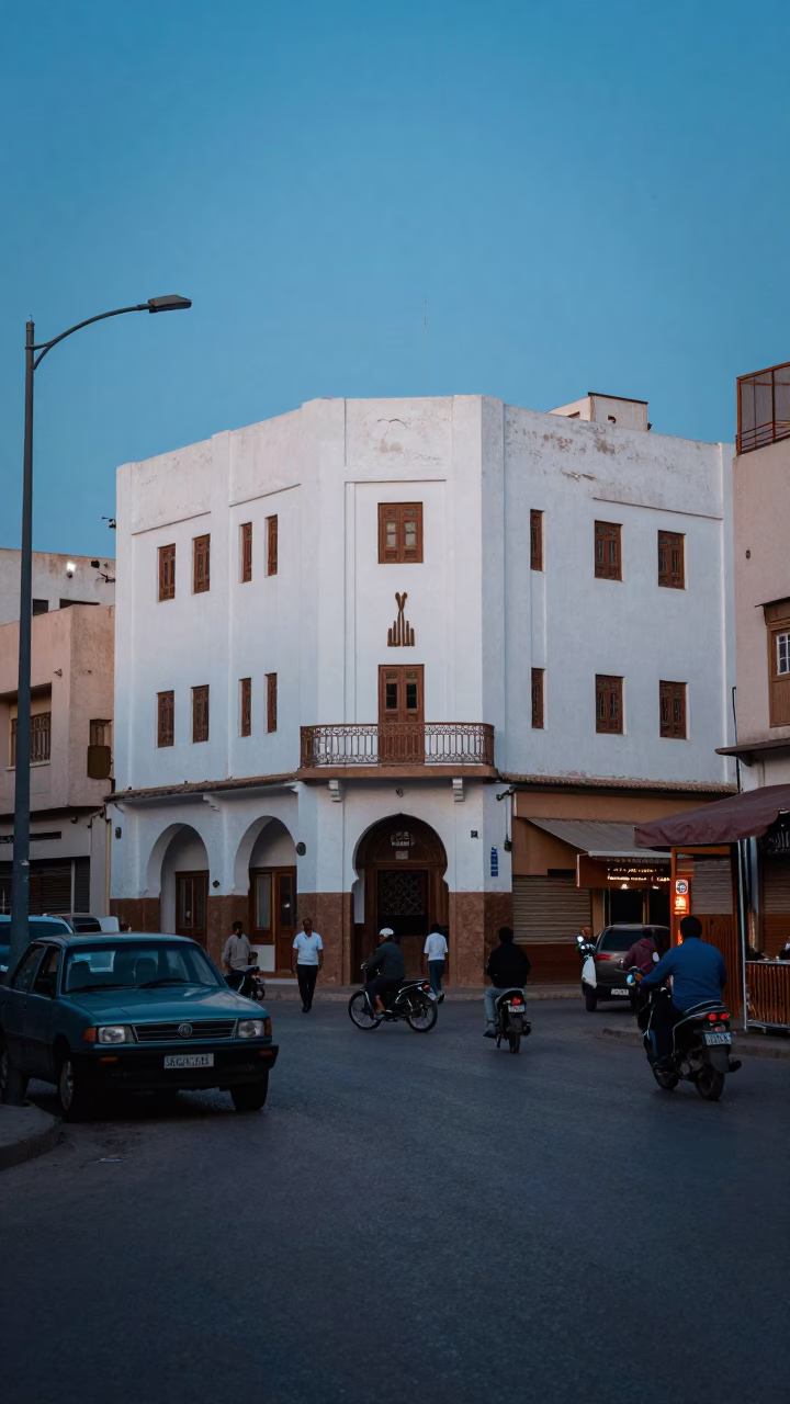 Busy Casablanca Morocco Street Scene Before Dawn with Vintage 1950s Architecture and Local Commerce in in Casablanca, Morocco