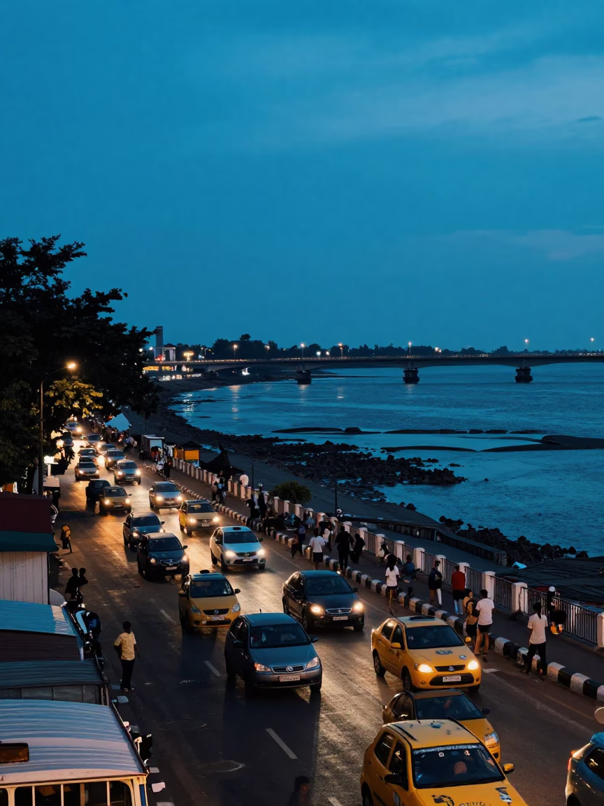 Busy Chennai Street Scene at Blue Hour with Lit Windows and Tidal Water Views in in Chennai, India