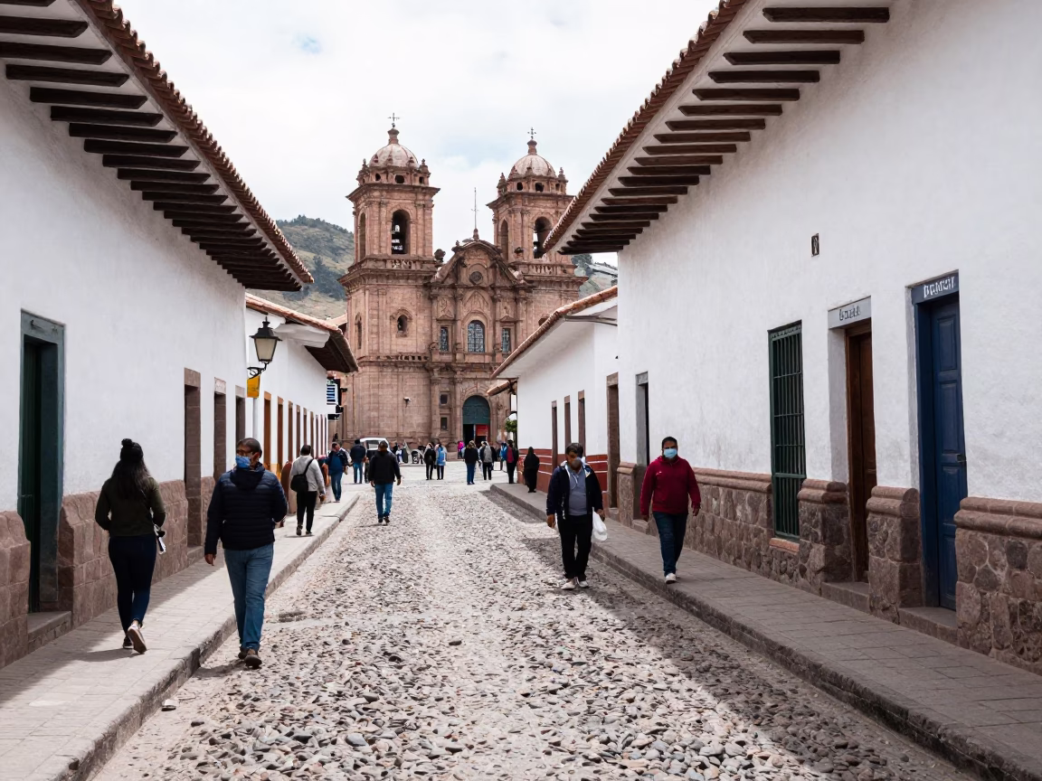 Busy Cusco Peru Street Scene with Cobblestones and Colonial Architecture in Bright Midmorning Light in in Cusco, Peru