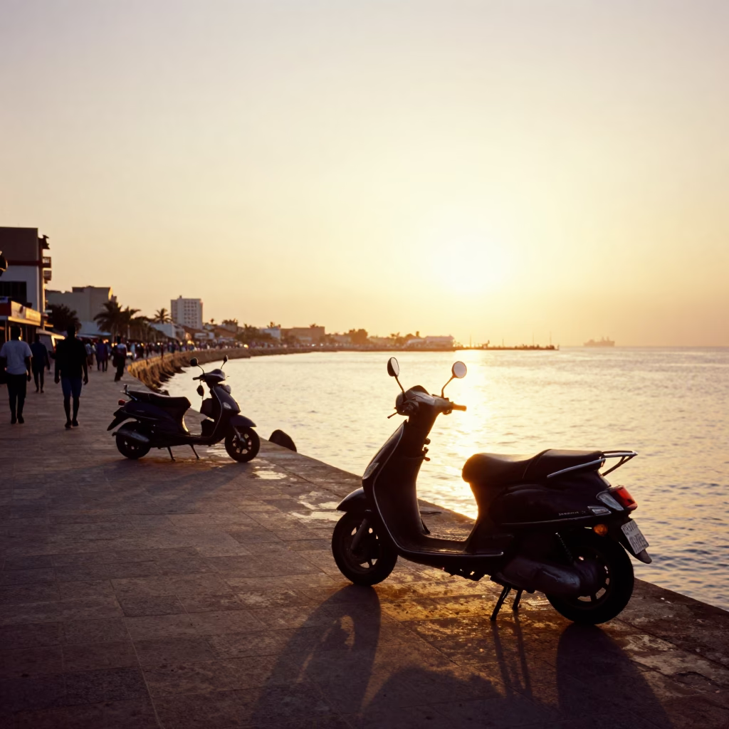 Busy Dakar Harbor Promenade at Sunset with Scooter and Ocean View in in Dakar, Senegal