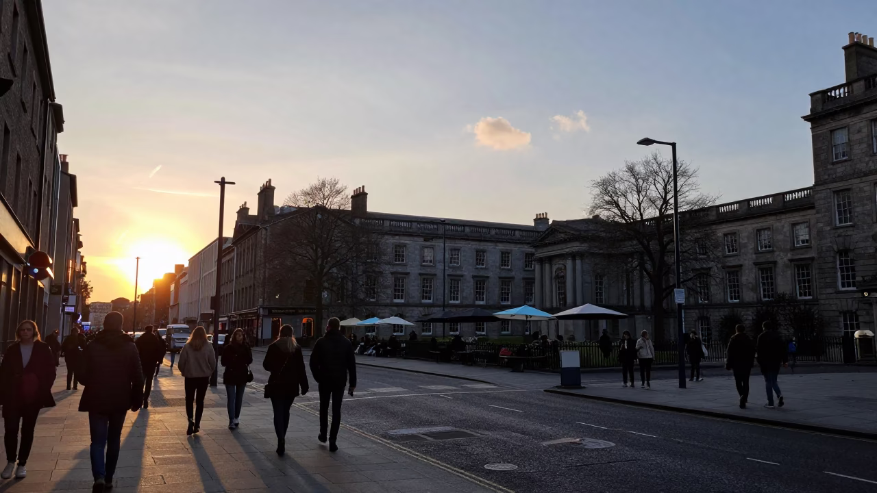 Busy Dublin Street Scene at Sunset with Umbrellas and Fire Engine in in Dublin, Ireland