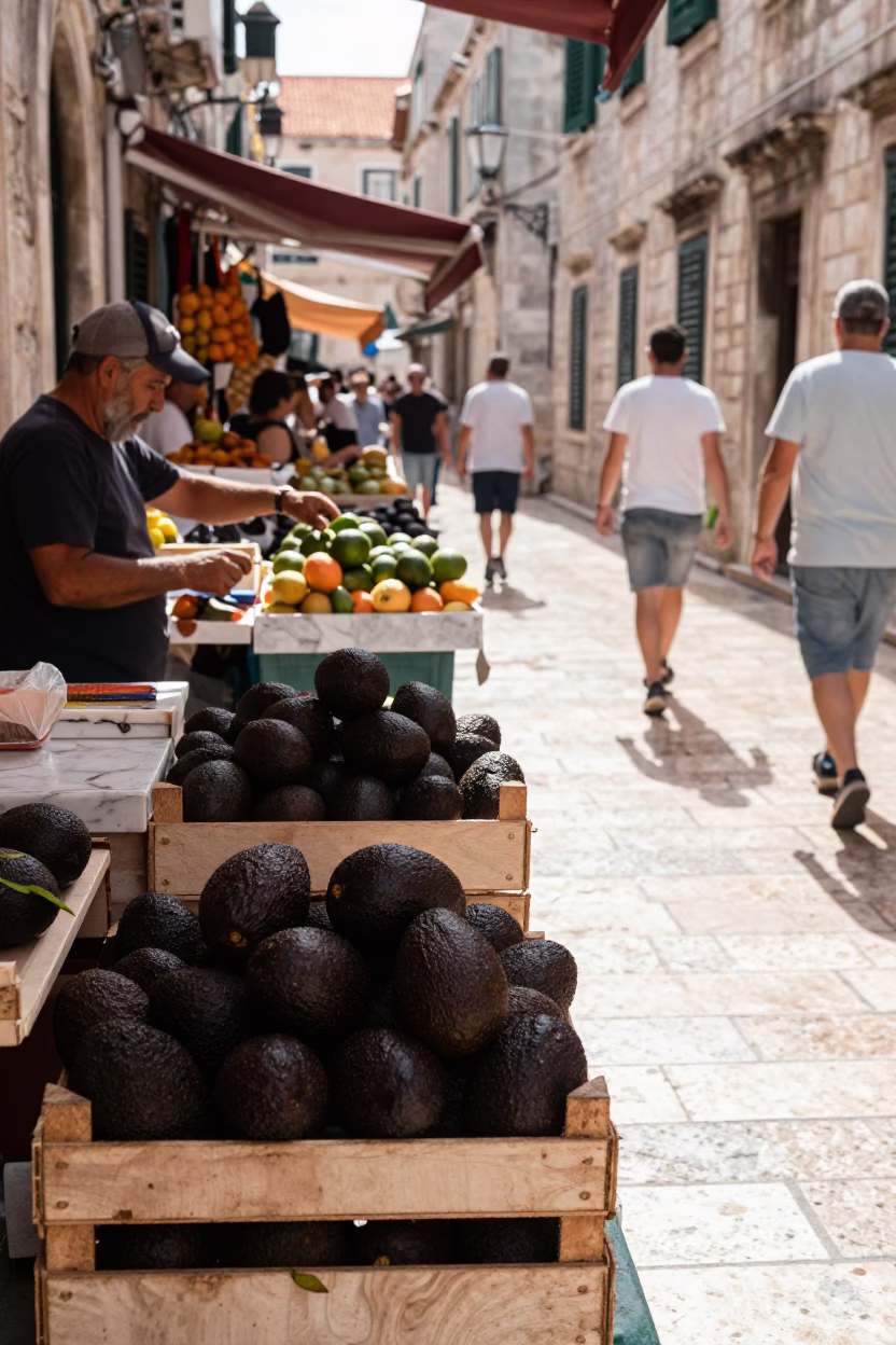 Busy Dubrovnik Street Market Scene with Avocados and Marble Under Midday Sun in in Dubrovnik, Croatia