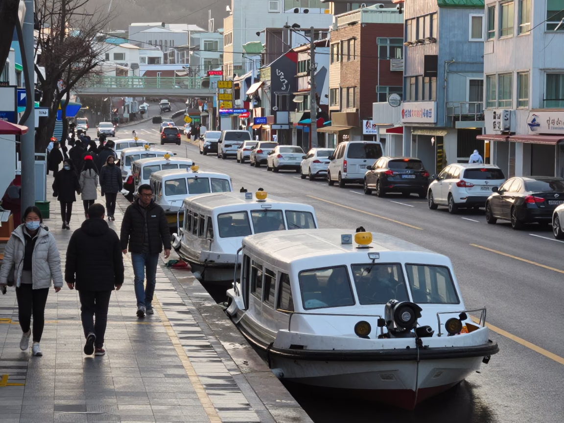 Busy Early Morning Busan Street Scene with Water Taxi and Local Activity in in Busan, South Korea