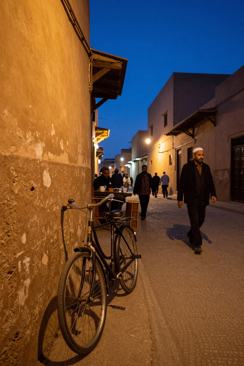 Busy Fez Morocco Street Scene at Twilight with Bicycle and Traditional Architecture in in Fez, Morocco