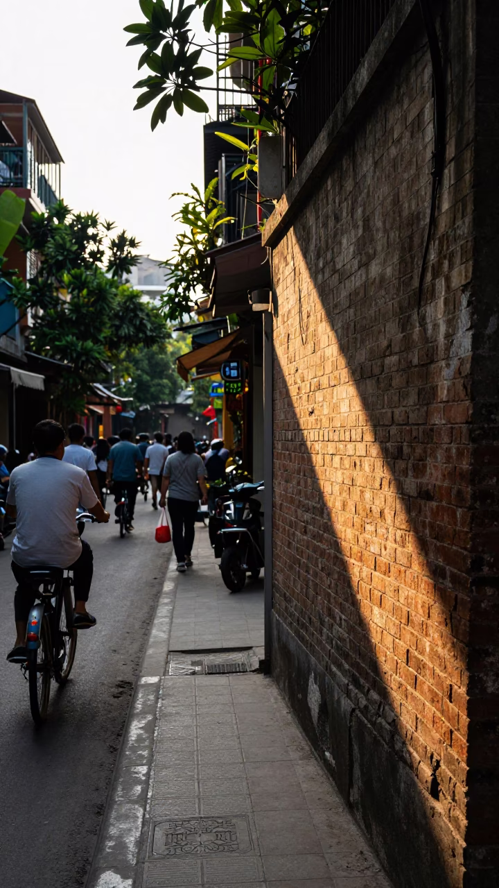 Busy Hanoi Street Scene Late Afternoon Sunlight on Old Quarter Sidewalk in in Hanoi, Vietnam