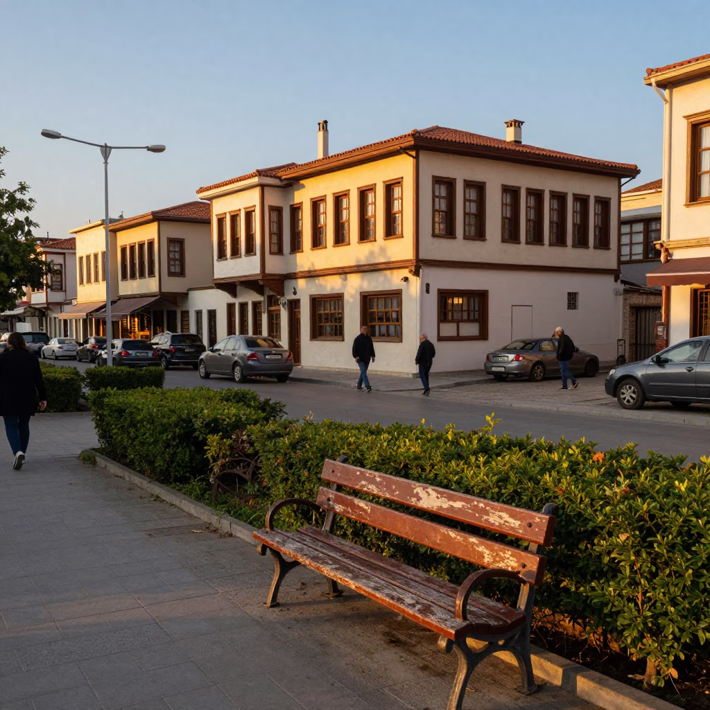 Busy Izmir Street Corner Honeyed Evening Light with Traditional Tea Tin and Park Bench in in Izmir, Turkey