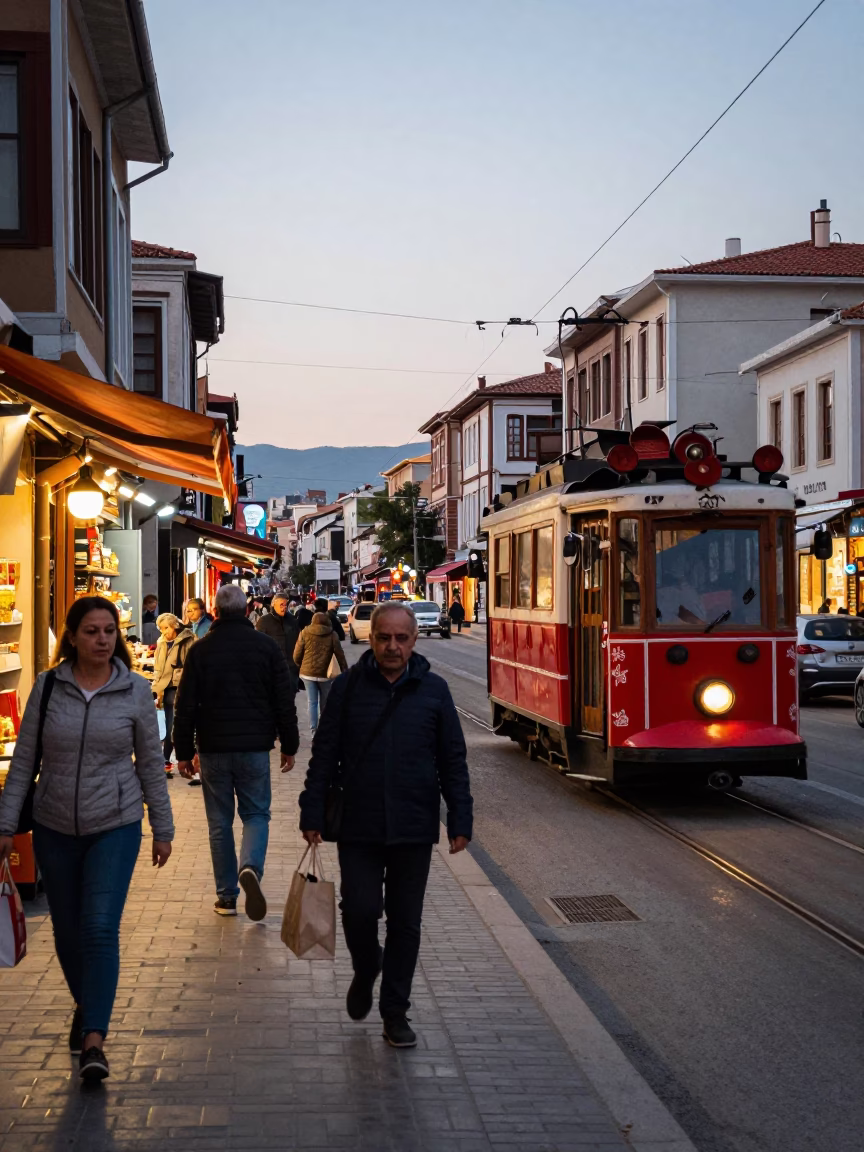 Busy Izmir Street Scene Early Evening with Tram and Local Market Activity in in Izmir, Turkey